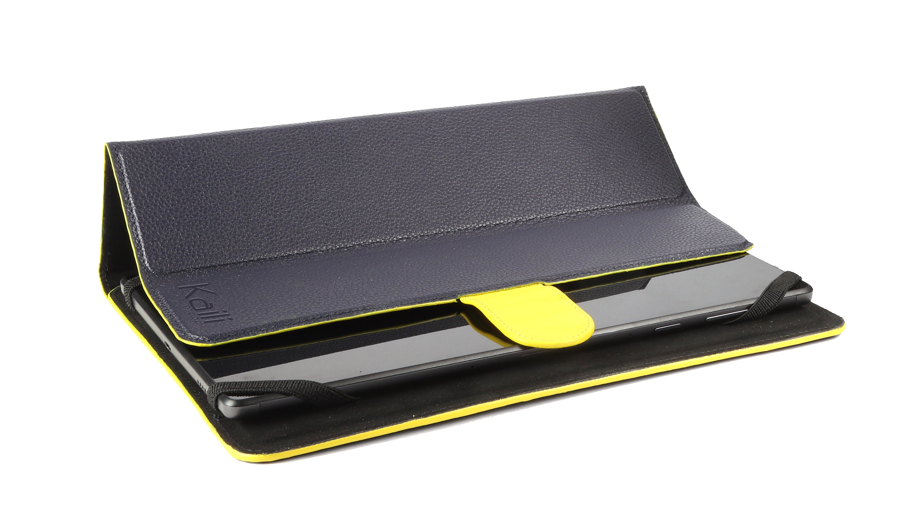 K0033DB | Tablet case Genuine leather, full grain, dollar grain. Col.Blue with Yellow edges. Contrasting tab closure. Dimensions: cm 19.5 x 25.2 x 1. Packaging: Tnt bag